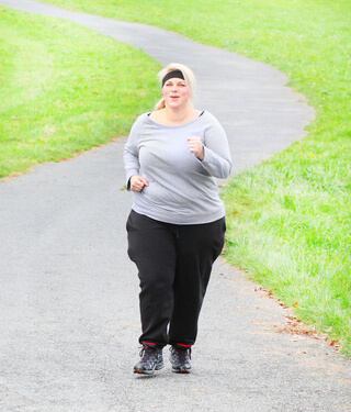 Overweight woman running. Weight loss concept.