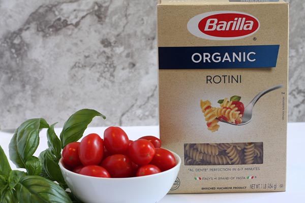 fresh tomatoes and basil in caprese pasta salad