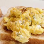 scrambled eggs on top of cinnamon toast
