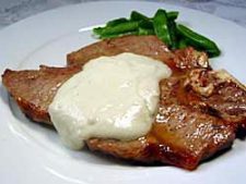 porterhouse steak topped with sauce