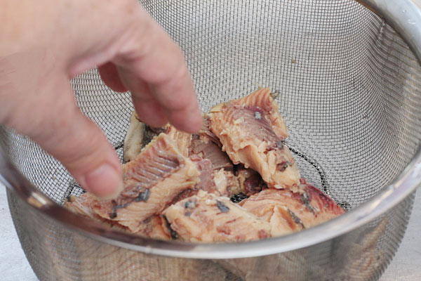 salmon being drained and picked over for bones