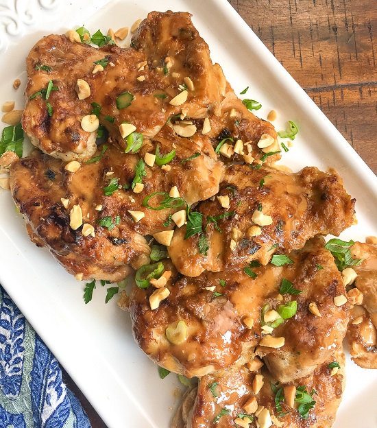 Instant Pot Thai Chicken Thighs on a white plate